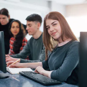 Corporate team training on laptops